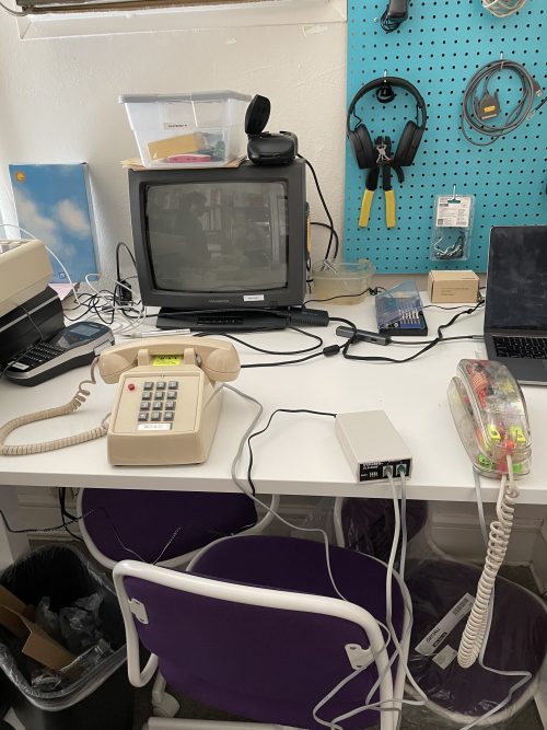 two analog phones and line simulator between