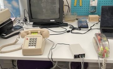 two analog phones and line simulator between