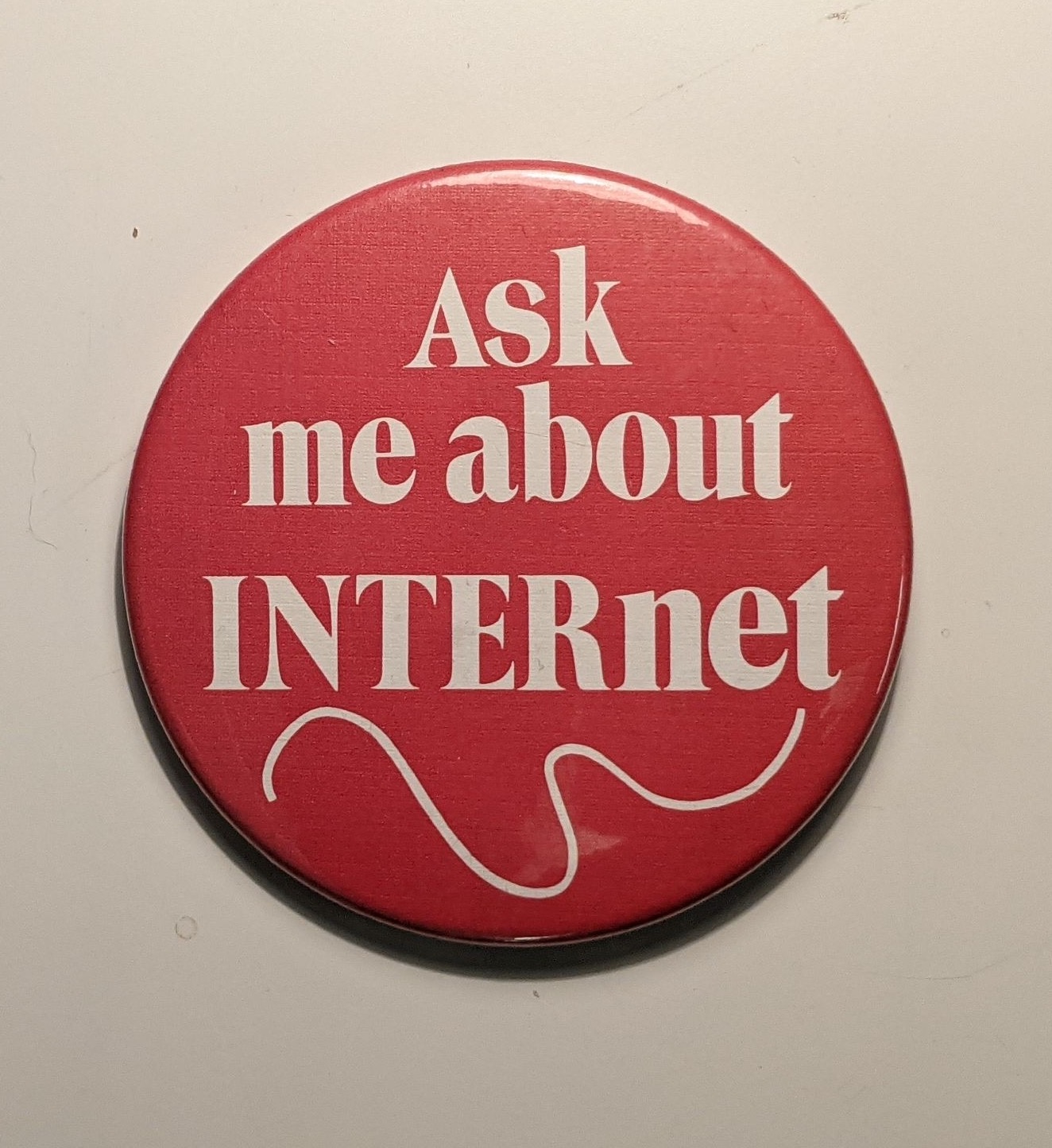 pin from the Media Archaeology Lab that reads "Ask me about INTERnet"